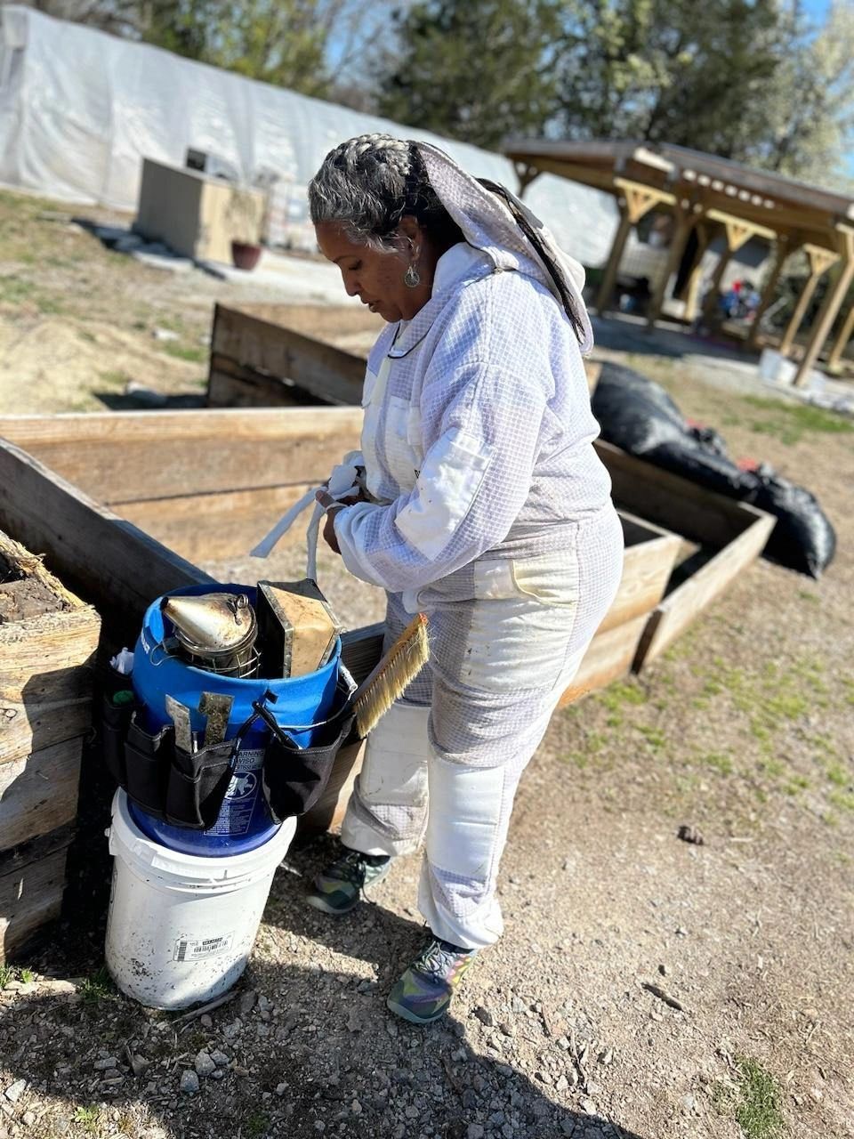 Hollee Freeman preparing to lead a hive check at “Hollee’s Hives” (urban apiary) at Petersburg Oasis Youth Farm