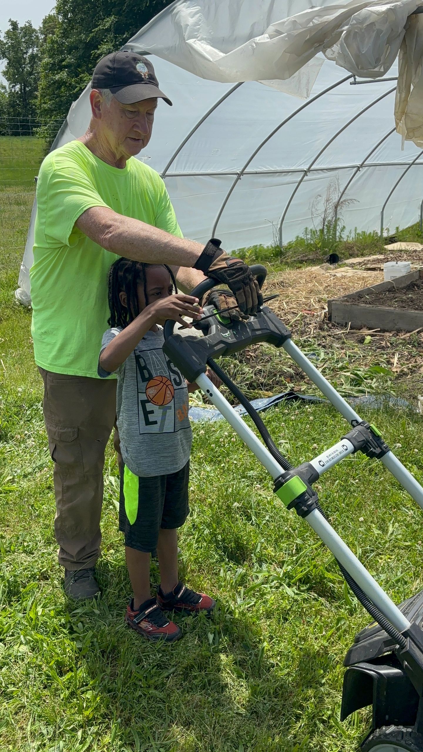 Volunteer Chair, Larry Bartenstein, leading the youth in refurbishing the Learning Garden at Pleasants Lane Elementary School 
