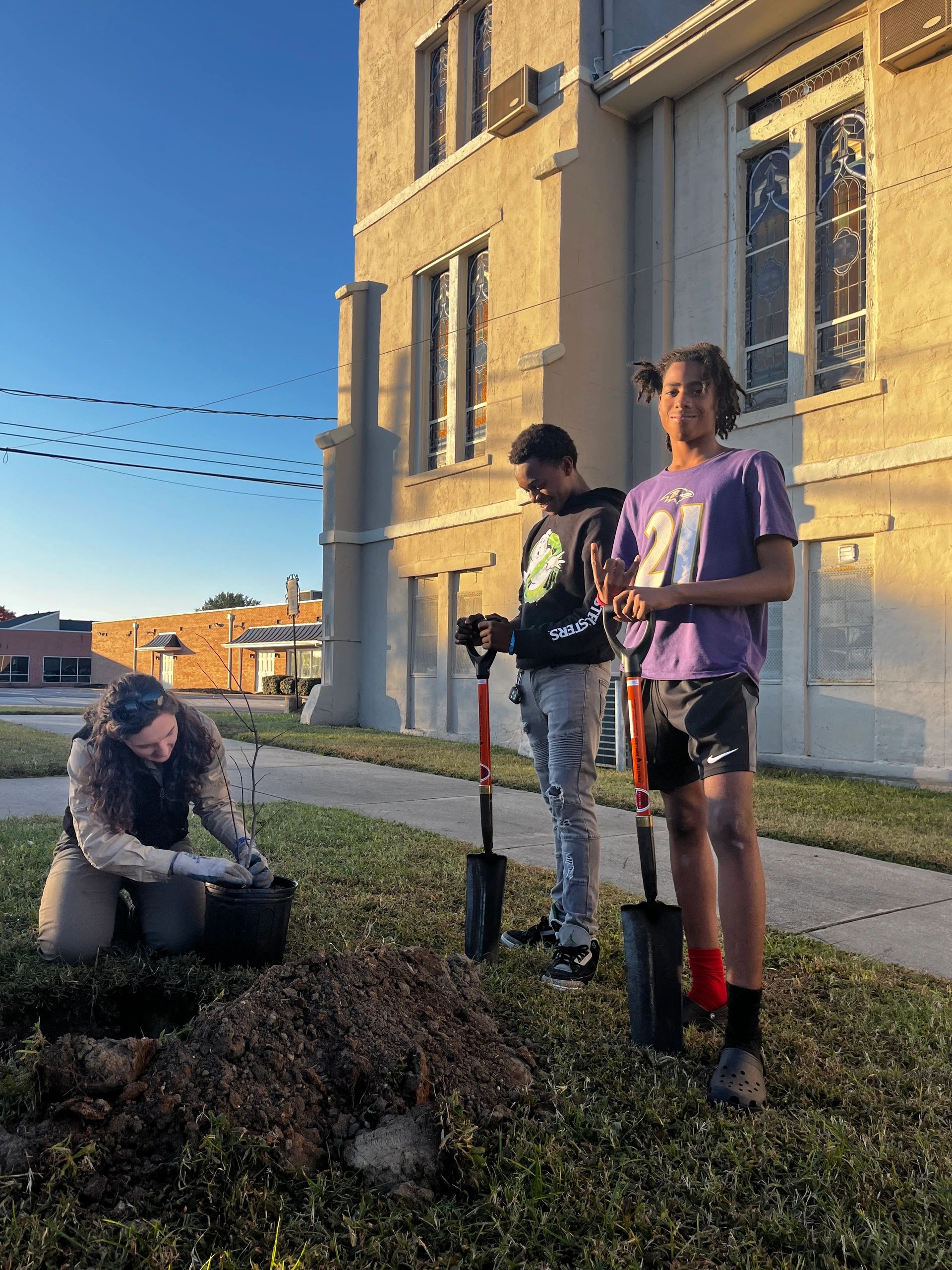 Local teens & Light Workers, learning how to properly plant native trees to help reduce Urban Heat Island Effect in Petersburg,Va 