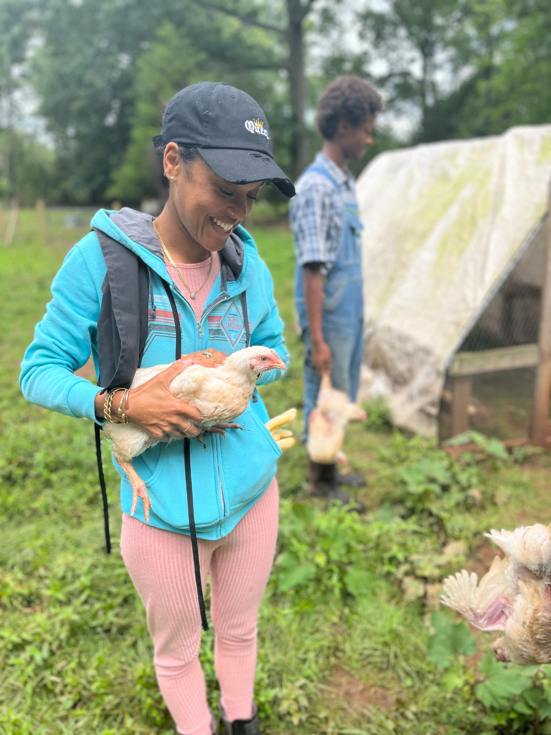Market Manager, Karima, getting to know the farm family at Fitrah Farm, while attending a Halal chicken processing workshop. 